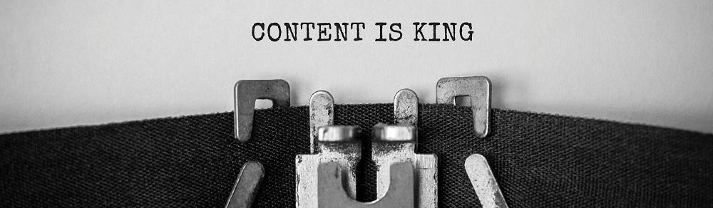 The words "content is king" typed on a page